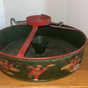 Vintage NESCO dancing/dkating Santa 14” round bucket Christmas tree metal stand